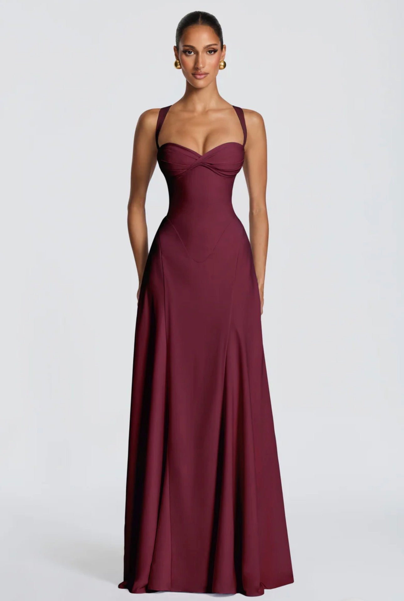 Abito Lungo Aura Corset Elegante ed esclusivo, l'abito lungo Aura ridefinisce la silhouette femminile con un corsetto delicato e spalline incrociate sul retro.